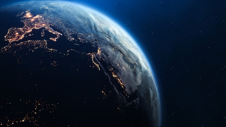 3D Render of Planet Earth with Clouds and City Lights.