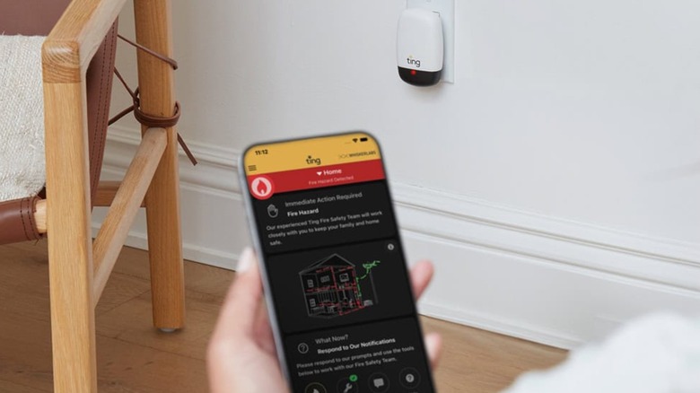 A person getting an alert from a Ting Fire Sensor on the Ting app.
