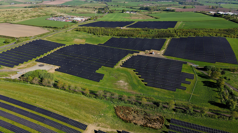 a large solar farm over hills in the UK