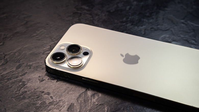 An iPhone 15 laying on a flat surface.