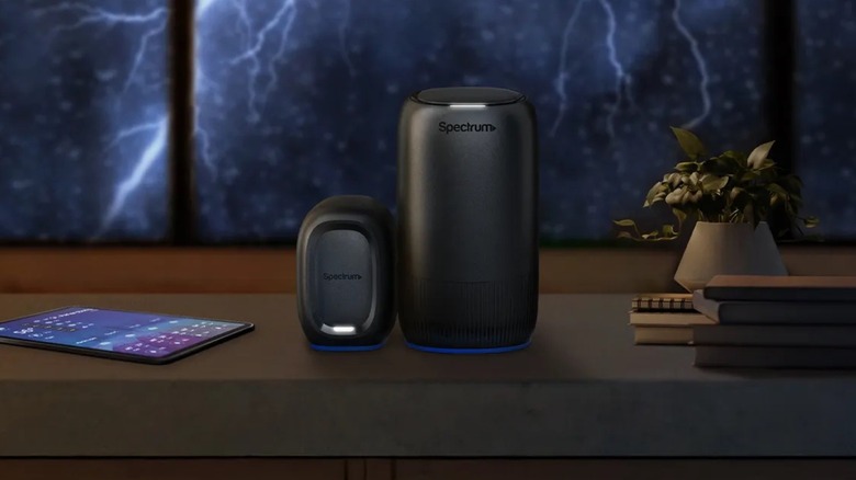 Spectrum WiFi 7 router on a table with a tablet nearby