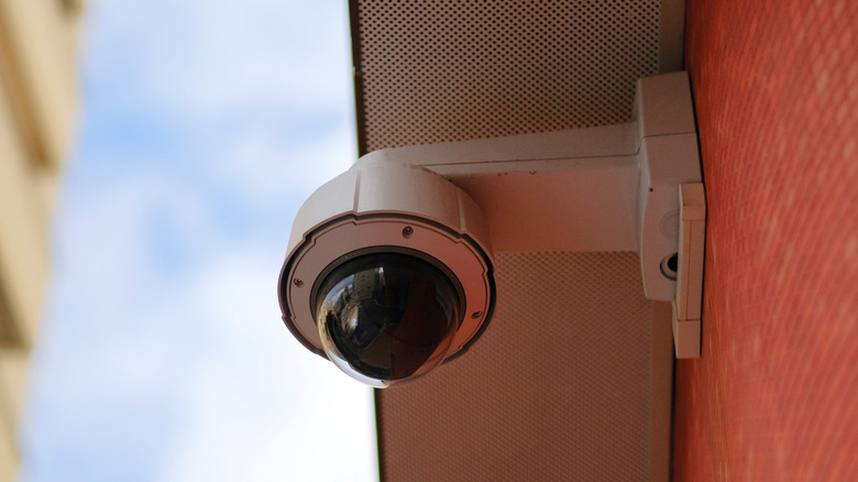 Dome security camera over a parking lot