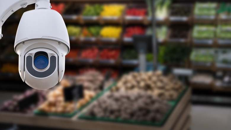 A security camera in the produce section of a grocery store.