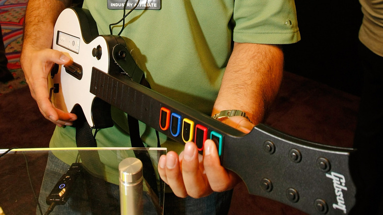 Person playing Wii guitar