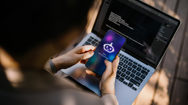 Woman using a chatbot with a MacBook Pro