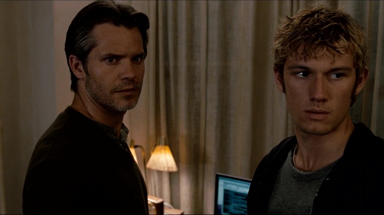 Henri (Timothy Olyphant) and John (Alex Pettyfer) standing next to each other in "I Am Number Four."