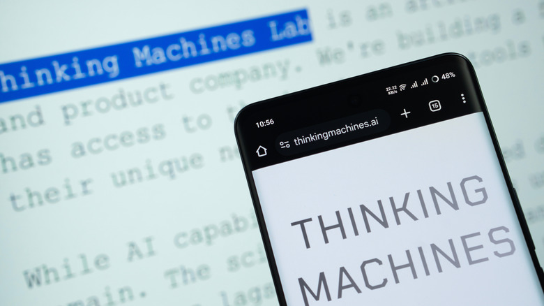 The Thinking Machines Lab website loaded on a computer and a phone.