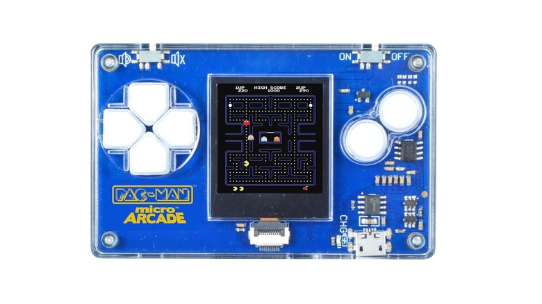The Micro Arcade Pacman keychain console has a transparent outer body through which you can see internal components, a D-pad on one side of the digital screen and two white buttons on the other