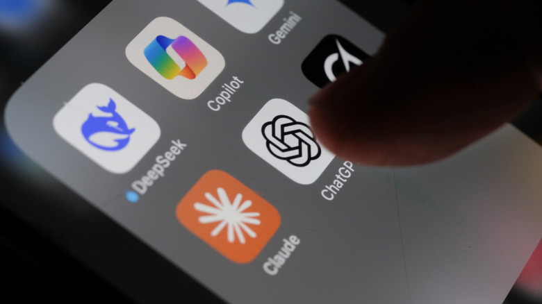 Finger tapping the ChatGPT icon on a mobile device.