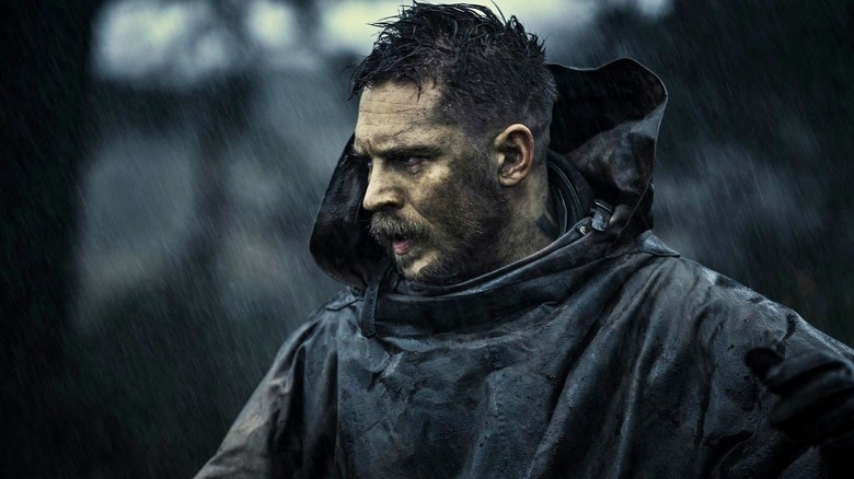 James Delaney wearing a raincoat in 