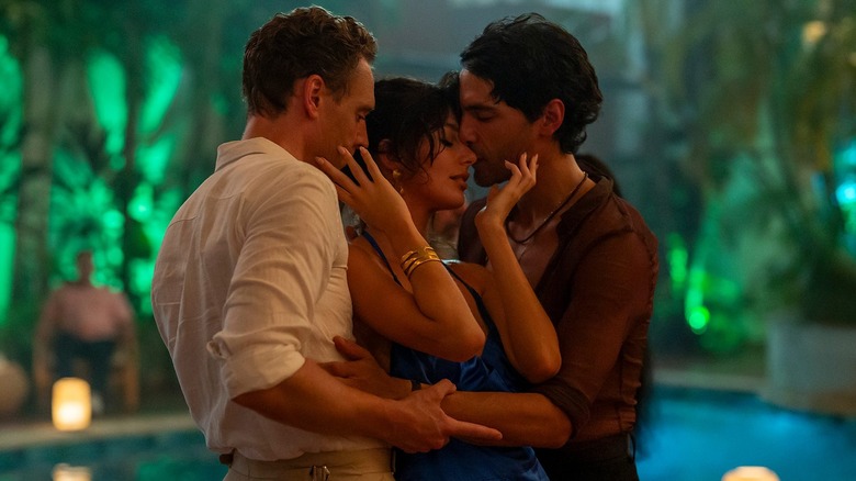 Diego Calva, Camilla Morrone, and Tom Hiddleston dance intimately.