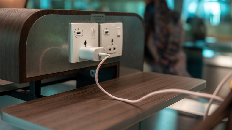 Public USB ports and power outlets at an airport