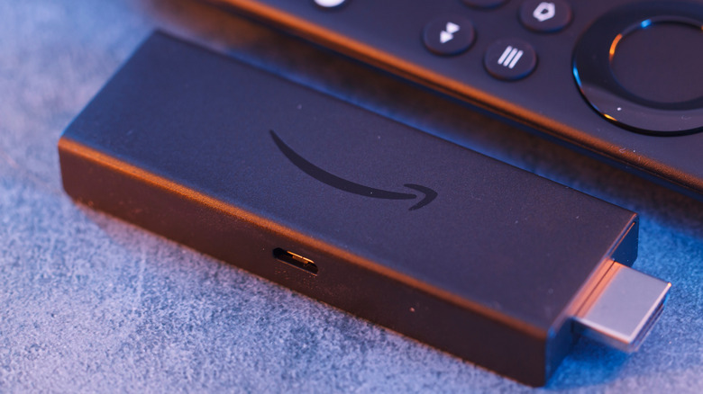 amazon fire tv stick and its remote controller placed together