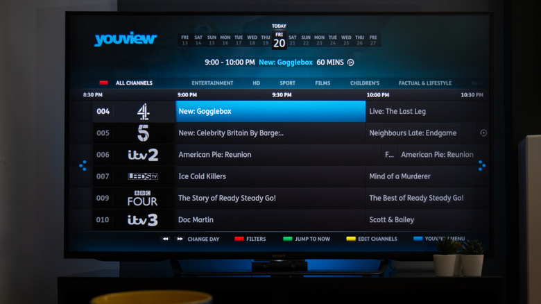 An EPG from British service YouView is displayed on a television.