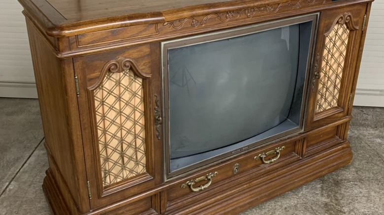 Zenith System 3 '80s TV sitting on pavement