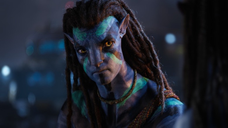 Jake Sully (Sam Worthington) in war paint in Avatar: The Way of Water