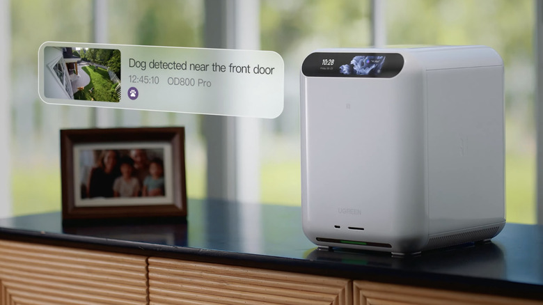The UGREEN HomeAgent on a sdieboard next to a framed family photo