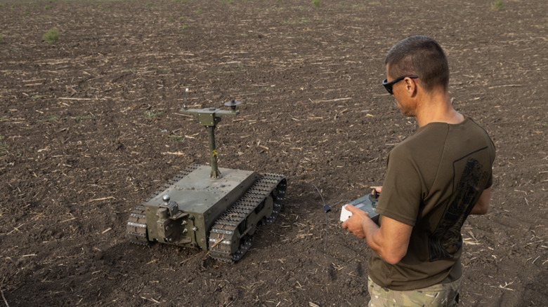 A Ukrainian soldier practices driving a remote controlled UGV.
