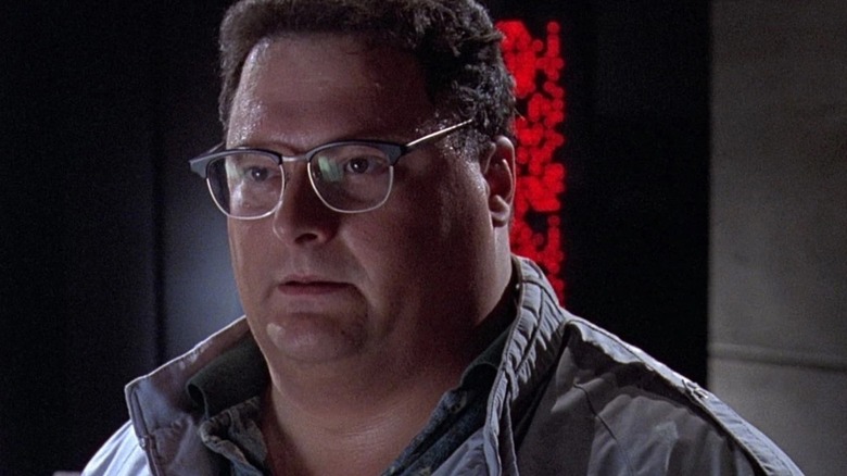 Dennis Nedry (Wayne Knight) in a jacket in Jurassic Park