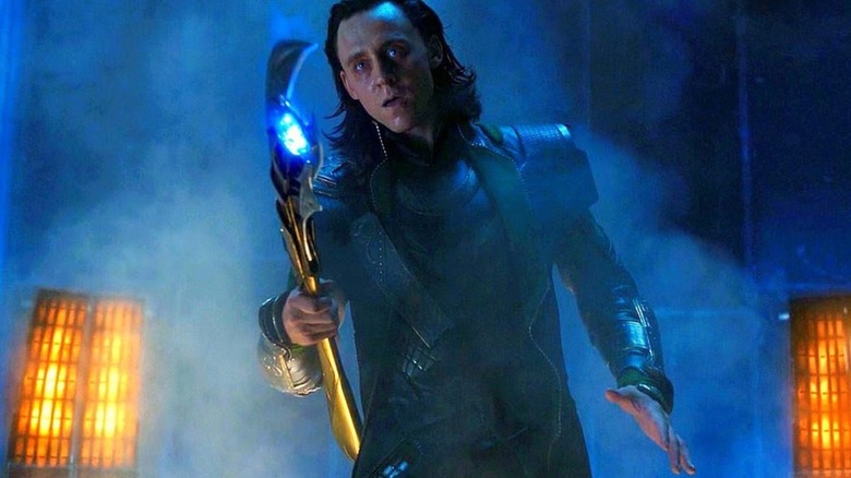 Loki (Tom Hiddleston) holding his scepter in The Avengers