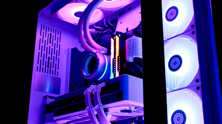 A high-end gaming PC with lots of LED lighting in a dark room