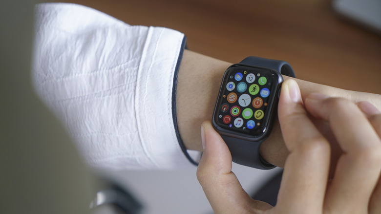 Person scrolling through apps on their Apple Watch