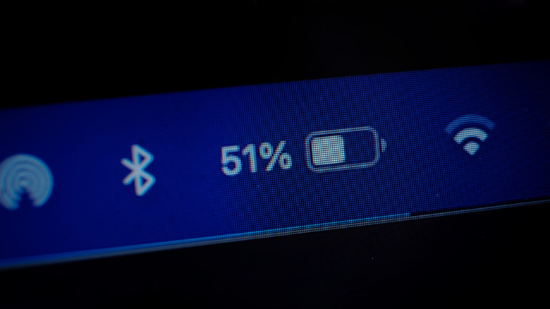 Picture of a digital display showing a charging icon with the battery percentage at 51 alongside other icons