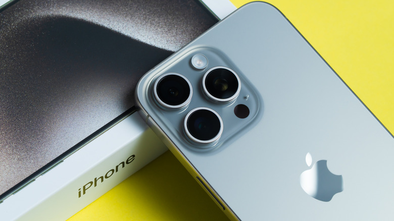 Back side of iPhone 15 Pro with its box