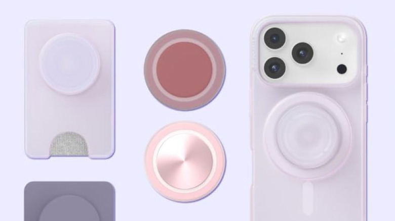 Various pink and purple PopSockets on a pale purple background