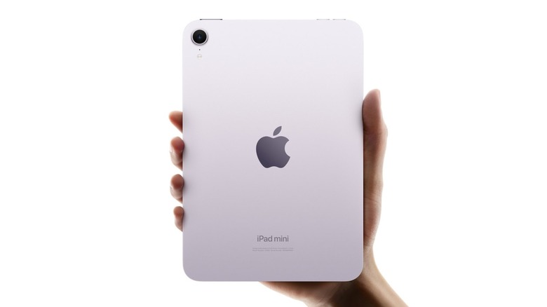 An iPad Mini held up against a blank white background