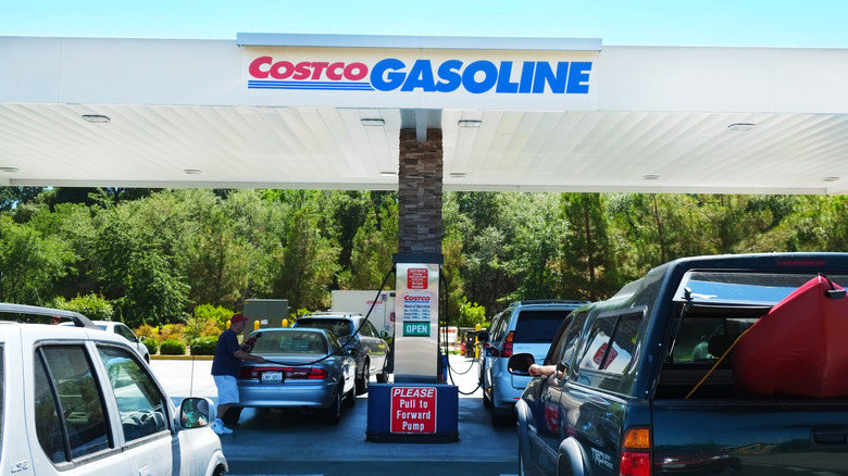 Vehicles waiting in multiple lines for the gasoline at Costco, members only, gas station.