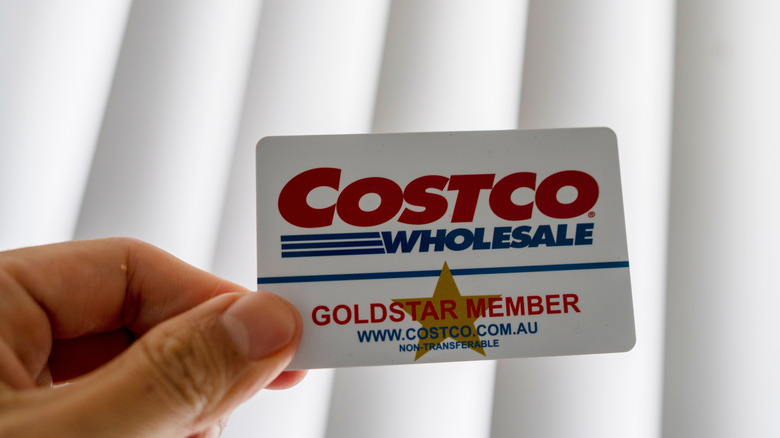 Hand holding Costco Wholesale membership card