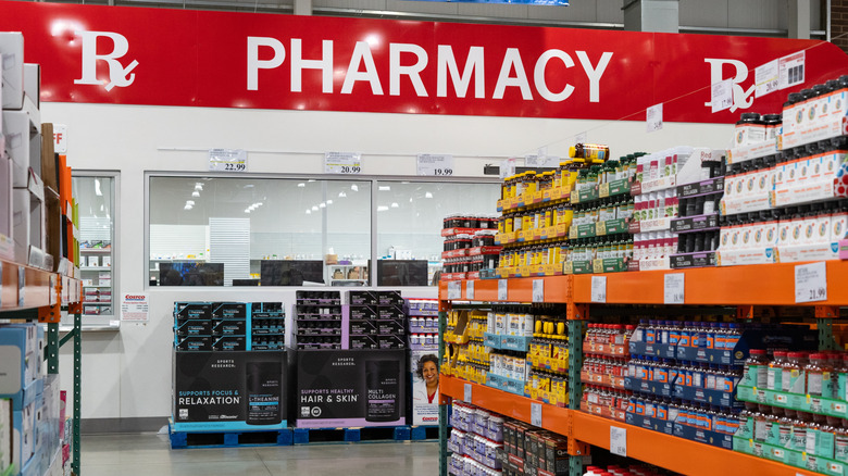 Interior view of a Costco warehouse pharmacy department with shelves and product displays