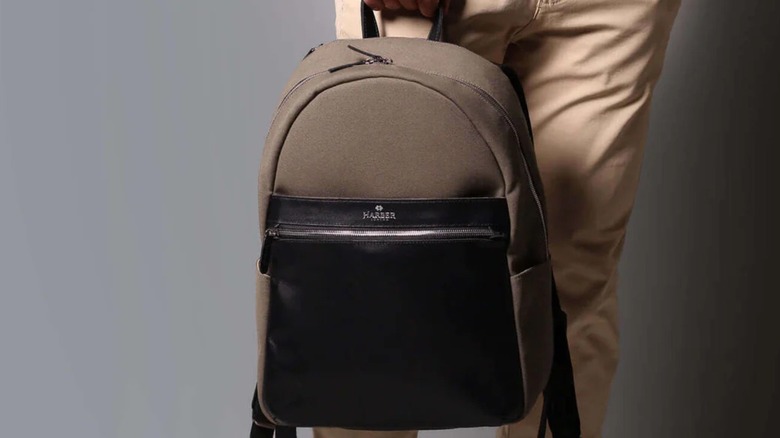 A man holding a backpack