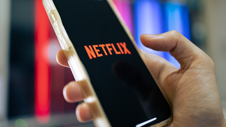 iPhone 13 showing its screen with Netflix application