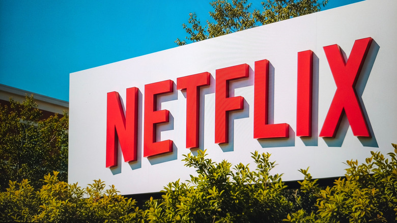 Netflix logo on a building exterior with trees and blue sky, California, US, October 9, 2025