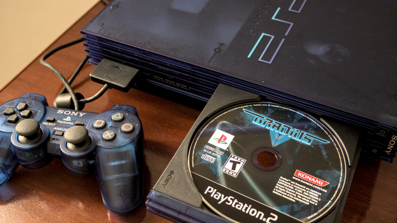 A PS2 Fat with a controller, and a disc of Gradius V