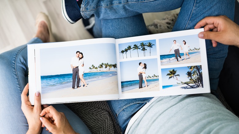 a couple looking at a photo album