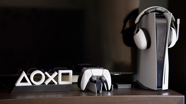 the PlayStation 5 with a controller and headset