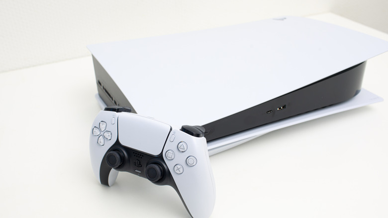 a PlayStation 5 with a controller