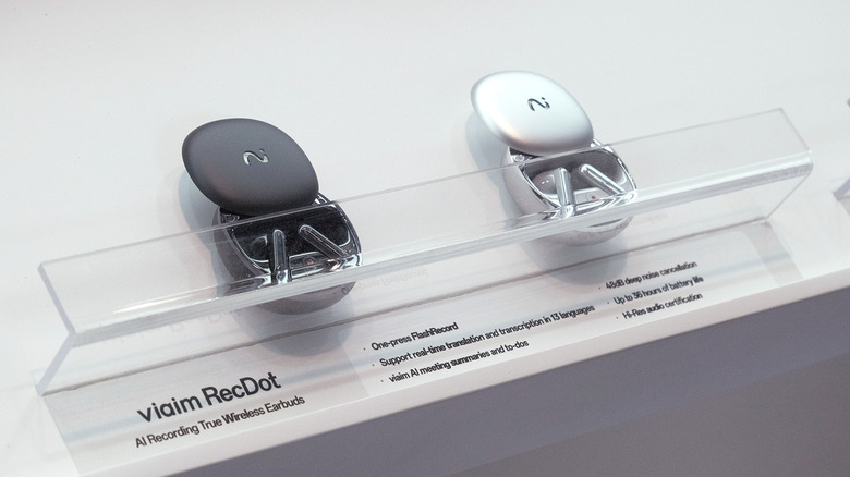 Two pairs of black and white Viaim RecDot earbuds on display