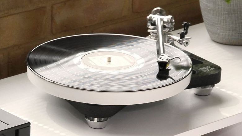 A Rega turntable on a white surface