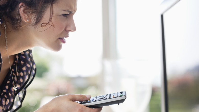 A person squinting at a screen