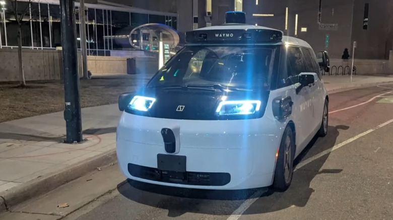 a Waymo self-driving car in a bike lane