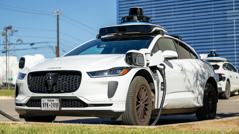 a Waymo robotaxi in a parking lot