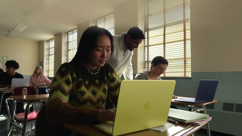 Students using MacBook Neo laptops in class.