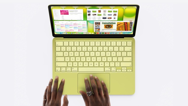 A person using the MacBook Neo with several apps open on the screen.