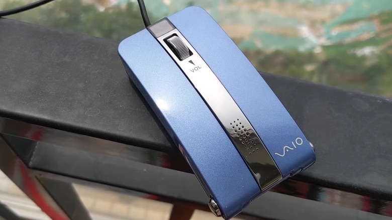 Blue Sony Vaio Mouse Talk on black railing
