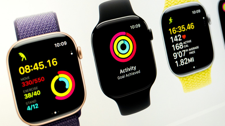 Three Apple Watch 11 smartwatches displaying health metrics