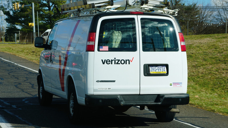 Verizon van and field service agent on the road.
